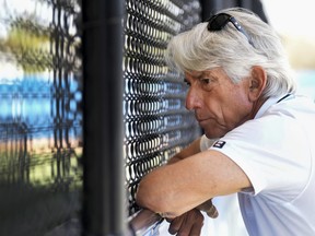 Toronto Blue Jays television analyst Buck Martinez watches a bull pen pitching session during baseball spring training in Dunedin, Fla., Monday, Feb. 20, 2023.