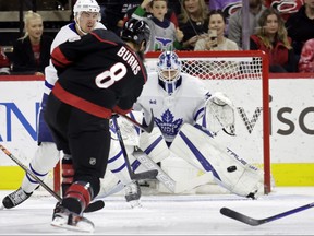 Carolina Hurricanes defenseman Brent Burns fires the puck past Toronto Maple Leafs defenseman Justin Holl, left, and goaltender Matt Murray, right, for a goal during the first period during an NHL hockey game Saturday, March 25, 2023, in Raleigh, N.C. (/)