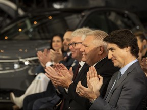 Prime Minister Justin Trudeau and Ontario Premier Doug Ford during an announcement on a Volkswagen electric vehicle battery plant at the Elgin County Railway Museum in St. Thomas, Ont., Friday, April 21, 2023.