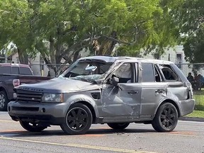 A damaged vehicle sits at the site of a deadly collision near a bus stop in Brownsville, Texas, on Sunday, May 7, 2023.