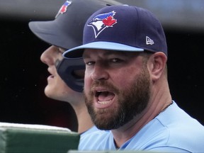 Blue Jays manager John Schneider stands in the dugout during the first inning against the Pittsburgh Pirates in Pittsburgh, Sunday, May 7, 2023.