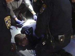 In this image taken from a nearly 18-minute video taken by a California Highway Patrol sergeant, Edward Bronstein, 38, is taken into custody by CHP officers on March 31, 2020, following a traffic stop in Los Angeles.