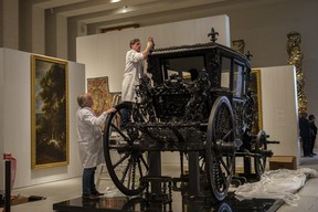 Staff members set up a Royal carriage