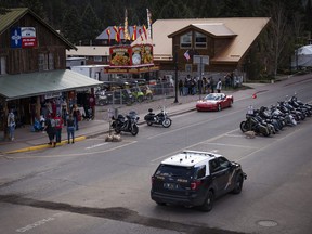 New Mexico State Police patrol Main Street in the area of Saturday's shooting in Red River N.M., Sunday, May 28, 2023.