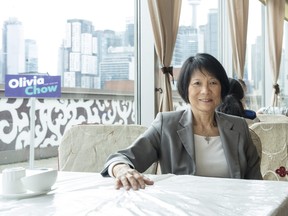 Mayoral candidate Olivia Chow sits in a restaurant in Chinatown