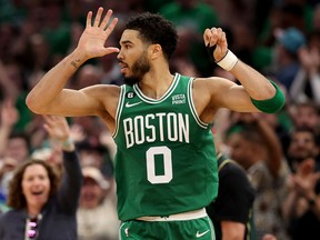 Jayson Tatum of the Boston Celtics celebrates breaking 50 points against the Philadelphia 76ers at TD Garden on May 14, 2023 in Boston.