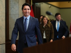 Prime Minister Justin Trudeau makes his way to the podium for a news conference on Parliament Hill in Ottawa on Monday, March 6, 2023. Trudeau is calling on the committee of parliamentarians that reviews matters of national security and the national intelligence watchdog to independently investigate concerns about foreign interference in Canada. THE CANADIAN PRESS/Sean Kilpatrick