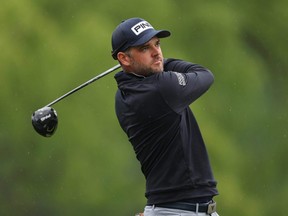 Corey Conners plays his shot from the eighth tee during the second round of the 2023 PGA Championship at Oak Hill Country Club in Rochester, N.Y., Friday, May 19, 2023.