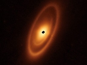 This handout image from the James Webb Space Telescope released by NASA/ESA/CSA on Tuesday, May 9, 2023, shows for the first time the inner asteroid belts that encircle the nearby star Fomalhaut.