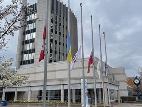 The flags at Burlington City Hall are lowered in memory of Jayne Hounslow, 8, in an image posted to Twitter by Mayor Marianne Meed Ward.