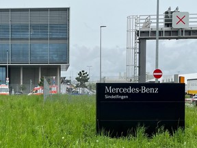 Ambulance cars are parked outside a Mercedes plant after a suspect was detained following a shooting at a Mercedes-Benz plant in Sindelfingen near Stuttgart, Germany, May 11, 2023.