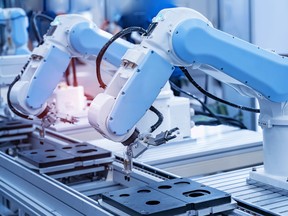 Automatic industrial robot works.