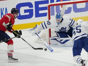 Florida Panthers centre Sam Bennett (9) tries to sneak a puck past Toronto Maple Leafs goalie Joseph Woll