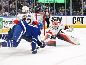 Florida Panthers goalie Sergei Bobrovsky (72) reaches for the puck as defenseman Gustav Forsling (42) covers Toronto Maple Leafs forward John Tavares (91) in the first period in game one of the second round of the 2023 Stanley Cup Playoffs at Scotiabank Arena on May 2, 2023. Dan Hamilton-USA TODAY Sports