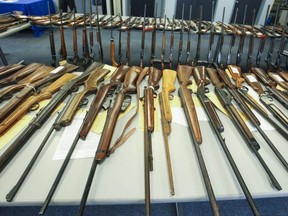 Halton Regional Police display firearms that were handed in to police in a firearms and weapons amnesty, Nov 17, 2014.