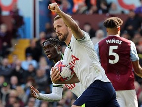 Tottenham Hotspur's Harry Kane celebrates scoring the team's first goal with Yves Bissouma against Aston Villa during Premier League action at Villa Park, Birmingham, Saturday May 13, 2023.