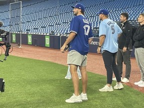 The Buffalo Bills quarterback showed up at the Blue Jays' batting practice Monday and liked what he saw.