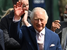 Britain's King Charles III leaves after speaking to well-wishers on The Mall near Buckingham Palace in central London, Friday, May 5, 2023, ahead of the coronation weekend.