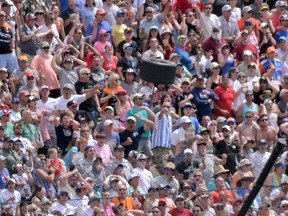A wheel flies near a section of grandstand during the Indianapolis 500