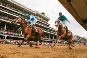 Jockey Javier Castellano on Mage (left) celebrates winning the 149th Kentucky Derby at Churchill Downs Racetrack in Louisville, Ky. on Saturday. LEANDRO LOZADA/GETTY IMAGES