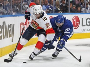 Maple Leafs defenceman Mark Girodano tries to check Panthers forward Anthony Duclair in Game 2 on Thursday.