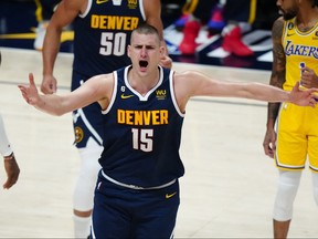 Denver Nuggets center Nikola Jokic reacts in the first quarter against the Los Angeles Lakers during Game 2 of the Western Conference Finals for the 2023 NBA playoffs at Ball Arena in Denver, May 18, 2023.