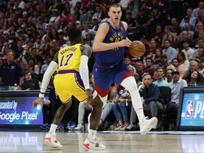 Nikola Jokic of the Denver Nuggets drives to the basket against Dennis Schroder of the Los Angeles Lakers during the third quarter in game one of the Western Conference Finals at Ball Arena on May 16, 2023 in Denver.