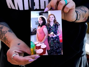 Ashleigh Webster shows a photo of her daughter, Ivy Webster, and her best friend, Tiffany Guess, who were both murdered in Henryetta, Oklahoma, May 2, 2023.