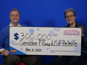 Twin sisters Geraldine Fobert and Joyce Brady, of Belleville, with their $300,000 prize from playing Plinko.