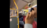 A screengrab from video of a person with fireworks on a TTC bus.
