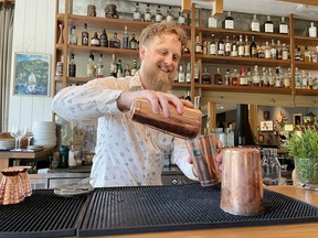 Carl Hamilton, the bar manager at Roar, mixes up a cocktail during a cocktail class.