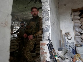 Ukrainian servicemen are seen at a frontline position