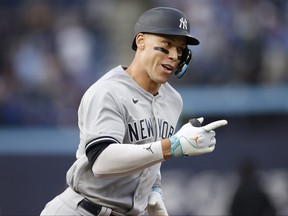 Aaron Judge of the New York Yankees runs out a home run in the first inning of their MLB game against the Toronto Blue Jays at Rogers Centre on May 15, 2023 in Toronto.