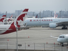 Air Canada planes sit on the tarmac at Pearson International