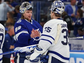 Tampa Bay Lightning goaltender Andrei Vasilevskiy (88) and Toronto Maple Leafs goaltender Ilya Samsonov (35) greet each over at the end of their first-round series.