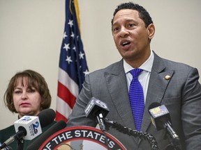 Baltimore State's Attorney Ivan J. Bates, right, speaks at a news conference, Jan. 20, 2023, in Baltimore.