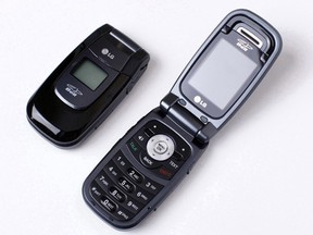 The LG 150, a compact black flip-phone, shown here open and closed, was today voluntarily recalled by LG Electronics.
