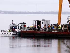 Ontario Provincial Police on Wednesday, May 3, 2023, work to recover human remains and a vehicle that were found while they were retrieving another vehicle from Lake Ontario earlier this year.