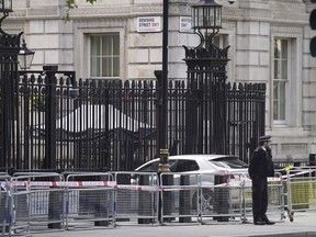 Man arrested after car collides with Downing Street gates in London