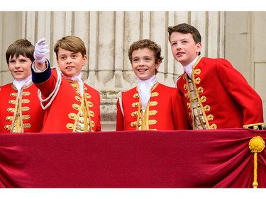 Left to right: Page of Honour Lord Oliver Cholmondeley, Prince George of Wales, Page of Honour Nicholas Barclay and Page of Honour Ralph Tollemache are seen on the Buckingham Palace balcony during the Coronation of King Charles III and Queen Camilla on May 6, 2023 in London.