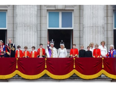 King Charles and Queen Camilla, Prince William, Catherine, Princess of Wales, and their children Prince Louis and Prince George, along with other members of the Royal family, stand on the Buckingham Palace balcony following the coronation ceremony in London, May 6, 2023.