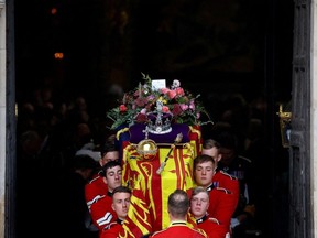 The coffin of Britain's Queen Elizabeth is carried out of Westminster Abbey after a service on the day of her state funeral and burial, in London, Britain, September 19, 2022.