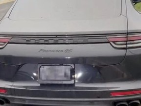 The driver of the Porsche was missing a plate, entirely on purpose. It had a licence-plate concealing device.