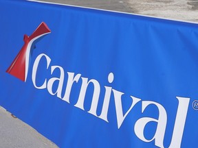 This Jan. 29, 2021 file photo shows a Carnival Cruise Line sign at PortMiami