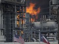 A fire burns at a Shell chemical facility in Deer Park, Friday, May 5, 2023 east of Houston.