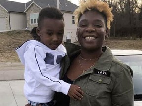 In this photo provided by Shyneisha Hill, Sir’Antonio Brown, left, is held in the arms of his mother, Shayna Davis, in 2019