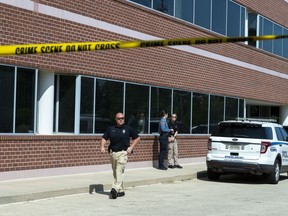 Law enforcement investigate after an attack at the office of Rep. Gerry Connelly, D-Va., in Fairfax, Va., Monday, May 15, 2023.