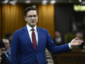 Conservative Leader Pierre Poilievre stands in the House of Commons.