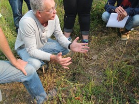 Alberta entomologist Kevin Floate, shown in this handout image as he speaks to students, is ready to start spreading the news that he has compiled a comprehensive guide into cow dung insects in Canada.