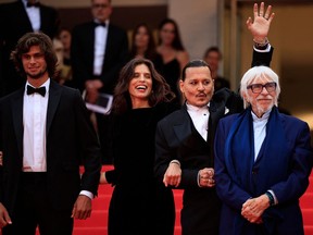 From left: French actor Diego Le Fur, French actress and director Maiwenn, U.S. actor Johnny Depp and French actor Pierre Richard pose as they arrive for the opening ceremony and the screening of the film "Jeanne du Barry" during the 76th edition of the Cannes Film Festival in Cannes, southern France, on May 16, 2023.